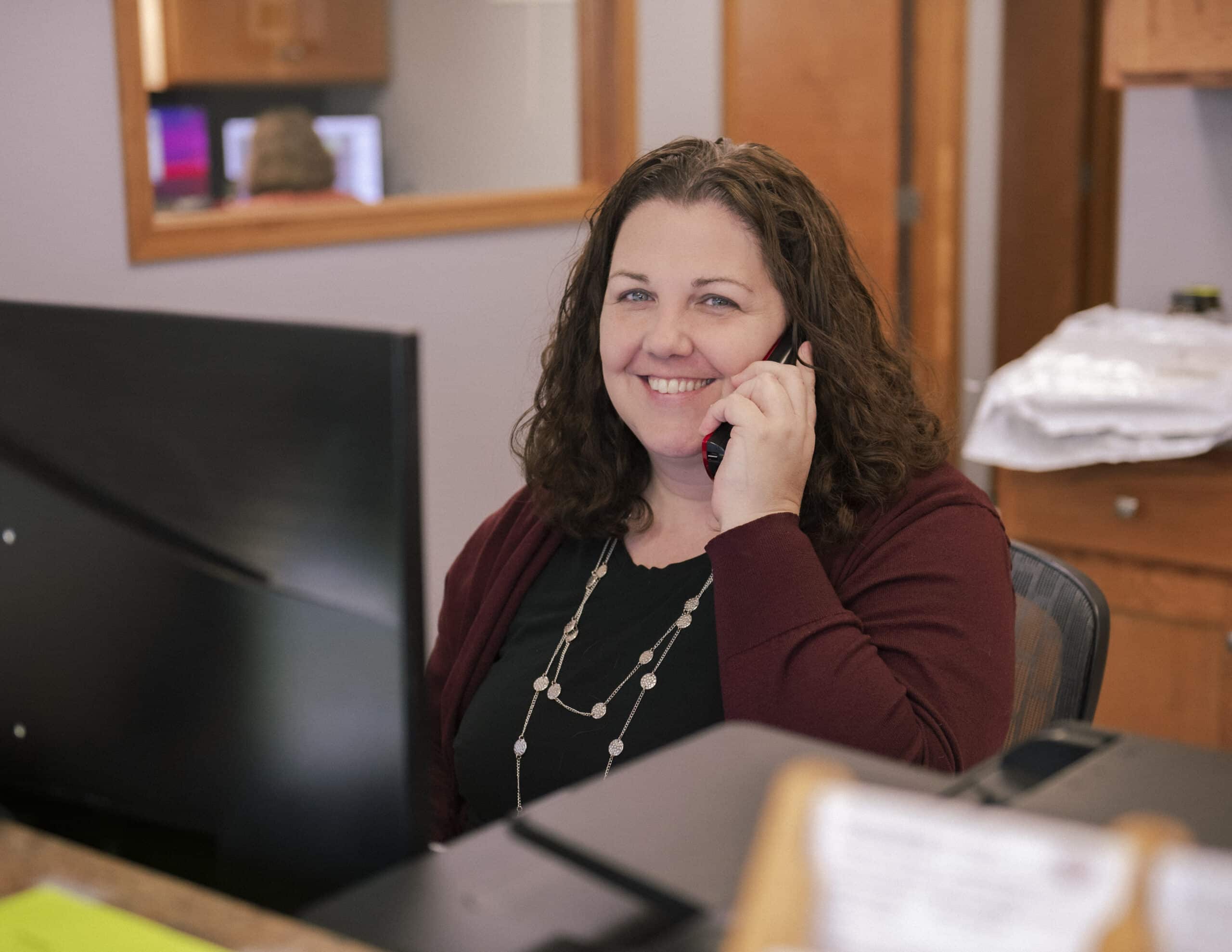 Answering A Phone Call At Reception Desk Scaled